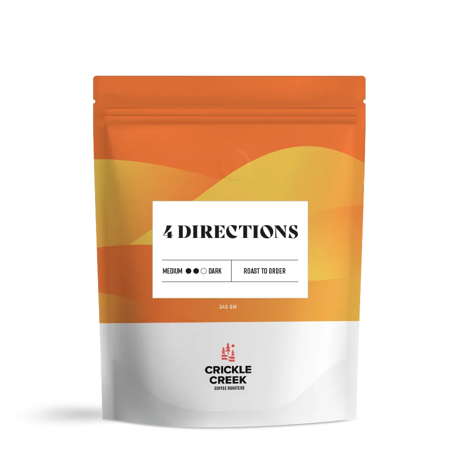 Specialty coffee blend bag labeled '4 Directions'; curated and roasted by Crickle Creek Coffee.