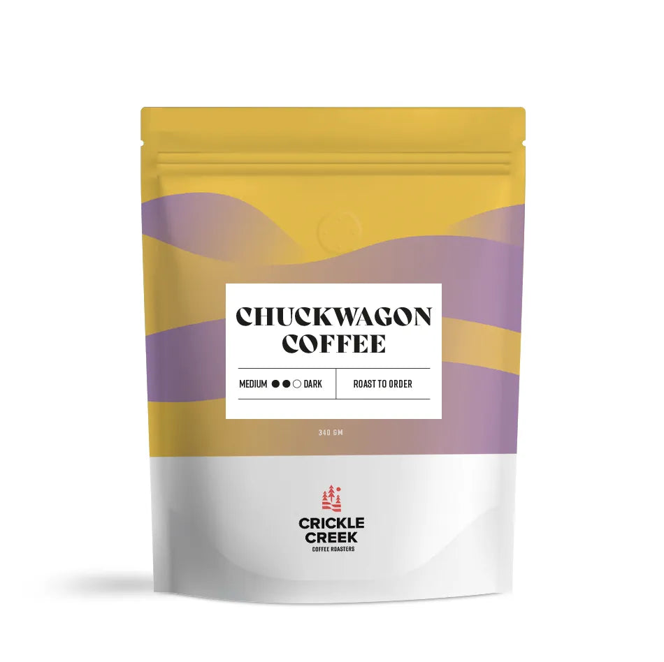 Specialty coffee blend bag labeled 'Chuckwagon Coffee'; curated and roasted by Crickle Creek Coffee.