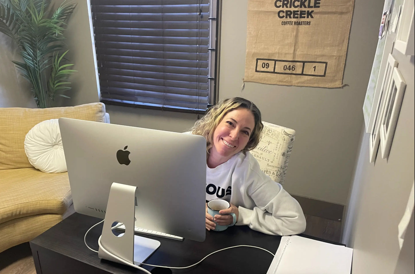 Adriana working at desk at the Crickle Creek roastery