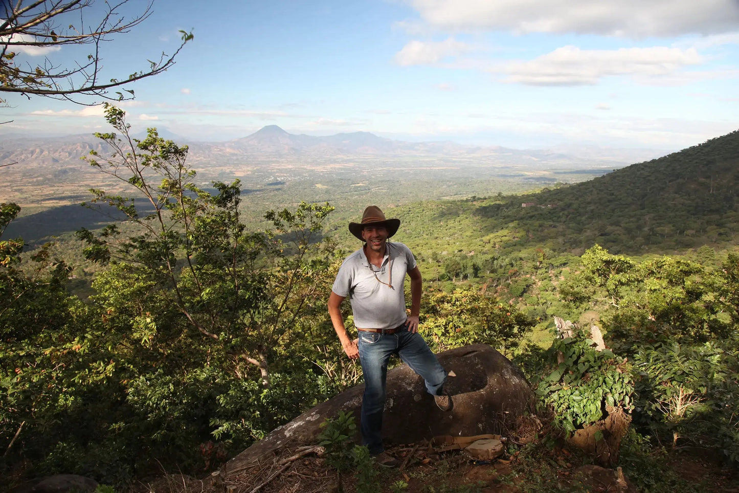 View from Coffee Farm in El Salvador with Alejandro wearing a hat