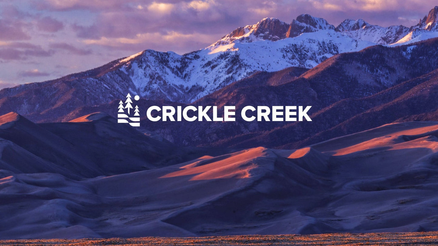 Mountain landscape with 'Crickle Creek' logo overlay